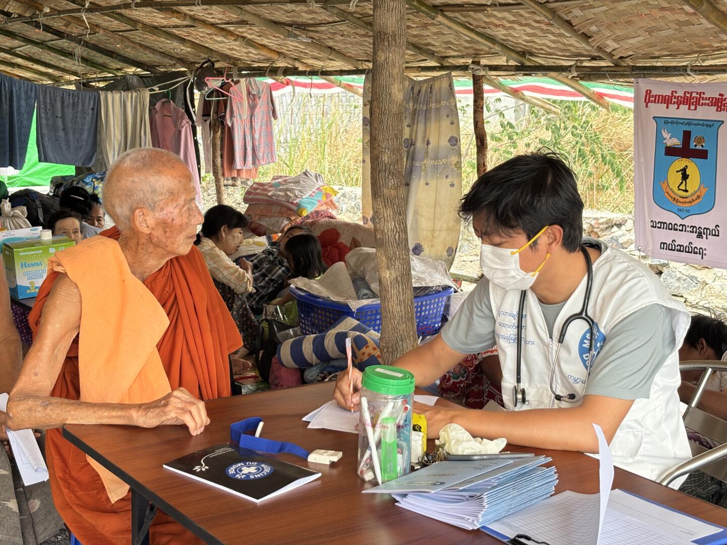 mdm_a-mobile-clinic-in-a-mandalay-township-sees-a-medical-team-leader-and-doctors-providing-essential-medical
